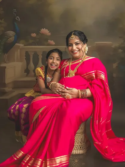 I love it when older siblings join the shoot. This is from my special painting-style saree session, where we blend tradition with fine art to create a timeless masterpiece for your family to cherish.