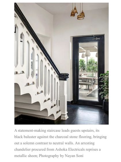 The statement-making staircase was a key focus of this feature. The article notes how the black baluster creates a solemn contrast against the neutral walls and charcoal stone flooring.