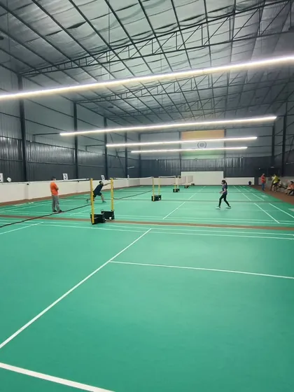 A wide shot of our newly opened Ghaziabad venue, showcasing the well lit, spacious interior with multiple badminton courts ready for action.