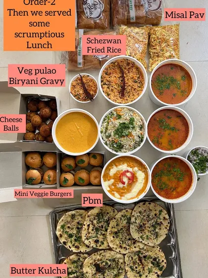A scrumptious lunch order featuring a mix of Indian and Indo-Chinese dishes. This spread included Veg Pulao, Schezwan Fried Rice, Misal Pav, Paneer Butter Masala, Butter Kulcha, and Mini Veggie Burgers.