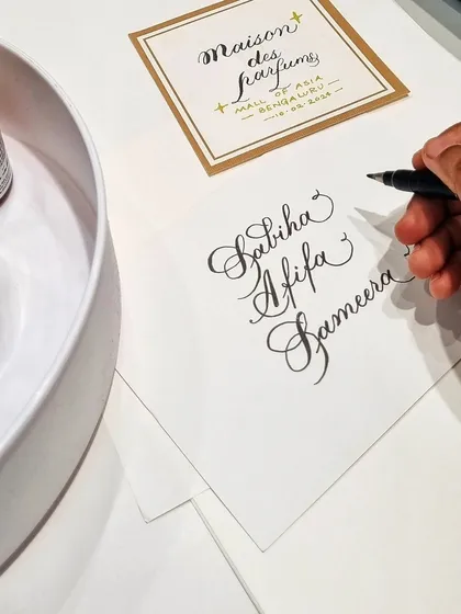Hand-lettering names for guests on custom cards. This on-the-spot service is a great way to draw a crowd and add a personal touch to any product launch or marketing campaign.