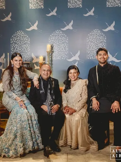 A beautiful family portrait from the 'Midnight Marrakesh' event. We always design our spaces with stunning photo backdrops in mind, like this wall with its custom hand-painted bird motifs.