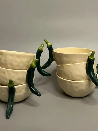 Spice up your mornings with my handcrafted chili ceramic mugs. The unique chili handle adds a touch of heat to your daily coffee or tea routine.