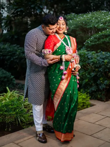 A warm embrace from the dad-to-be, showing the love and support surrounding the expecting mother during this special time.