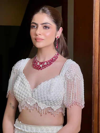 A perfect portrait of a modern bride. The high ponytail and soft glam makeup create a chic and sophisticated look that is perfect for a contemporary wedding.