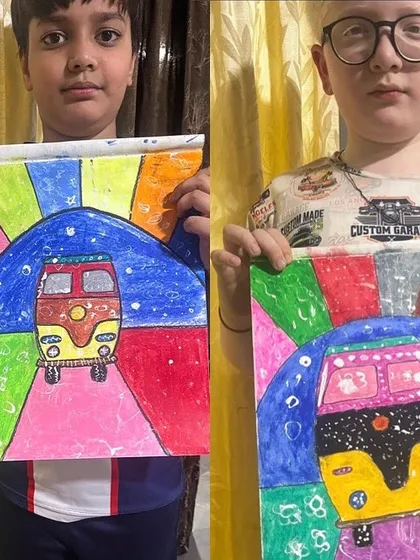 These two students show off their vibrant auto-rickshaw art. It's a fun and colorful project that captures a slice of Indian life.