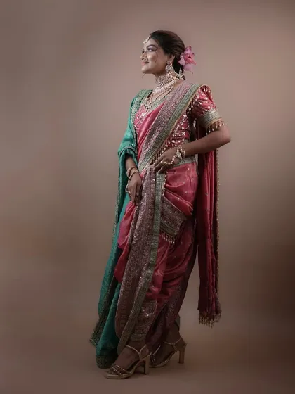 A profile shot capturing the complete silhouette of the Marathi bridal look, from the hairstyle to the drape of the saree.