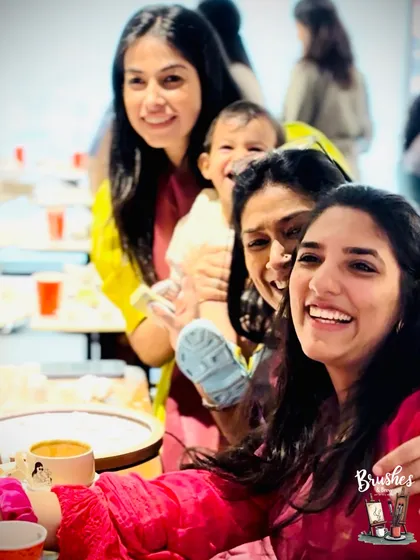 A beautiful lineup of happy faces and shared laughter. This is what community and celebration look like at Brushes & Brew.