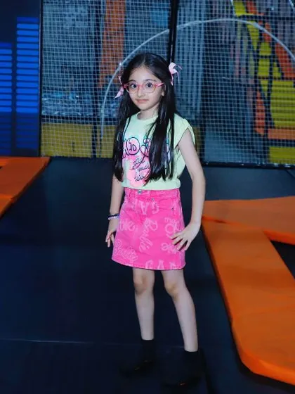 A stylish young guest strikes a pose in our trampoline park. It's a place where kids can be themselves and have a blast.