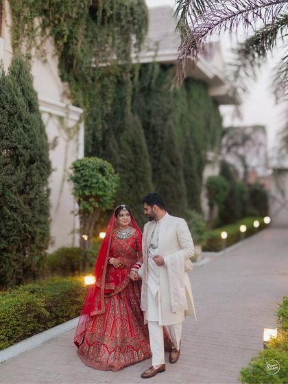 A couple takes a walk together after their wedding ceremony. This simple, elegant shot captures a quiet moment of connection as they begin their new journey together.