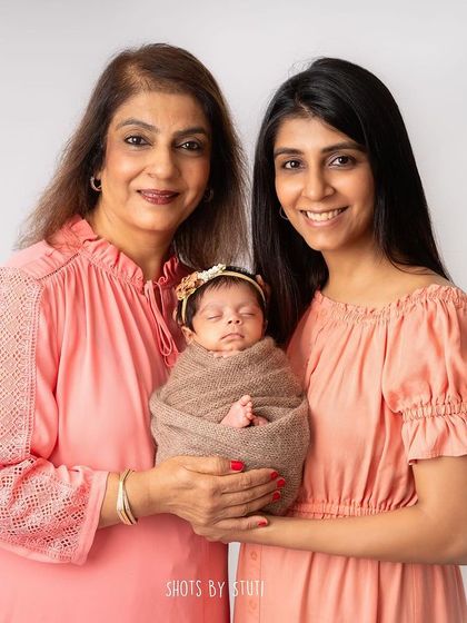 Three generations of beautiful women. Capturing a photo with grandma, mom, and the new baby is a priceless heirloom.