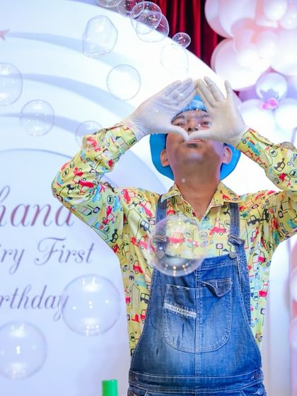 Another shot of the bubble artist's performance, showing his love for his craft and the magical atmosphere he creates.