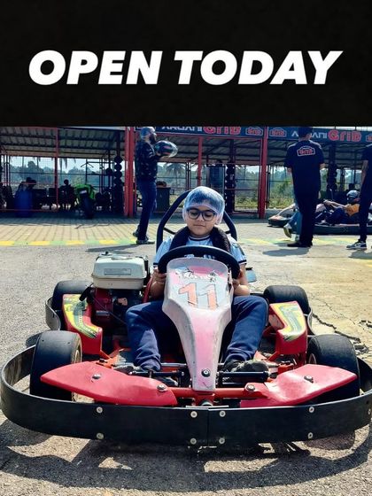 Our track is open and ready for racers of all sizes. This young driver is all set to experience the thrill of go-karting.