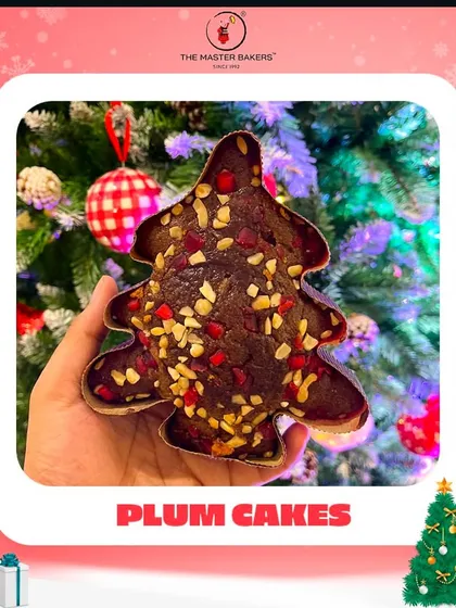 The holiday season isn't complete without the taste of a classic plum cake. Our Christmas tree-shaped plum cake, rich with fruits and nuts, is a festive favorite that brings the magic of the season to your dessert table.