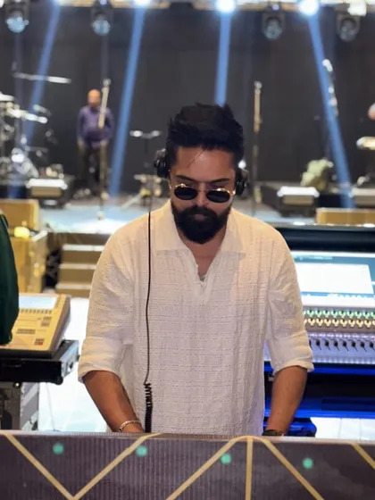 In the zone at a large-scale event with a full stage setup in the background. No matter the size of the production, my focus is always on delivering a perfect set.