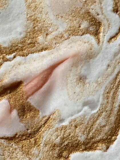 A texture shot of soap batter with golden mica swirls. We believe skincare is an art form, and we love capturing these beautiful moments.
