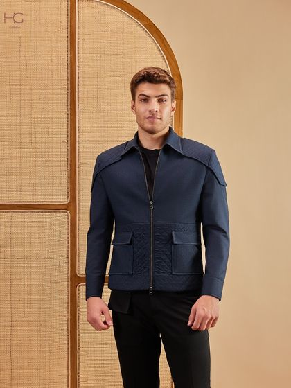 Uplift your look from casual to classy with just one layer. This navy zip-up shacket features quilted pocket details and a sharp silhouette for a refined yet modern appeal.
