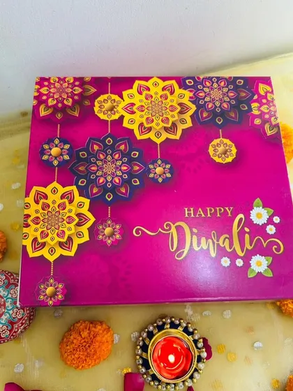 The beautiful floral-themed box for my 'Zayka Diwali' hamper. The bright pink and gold design is perfect for festive gifting.
