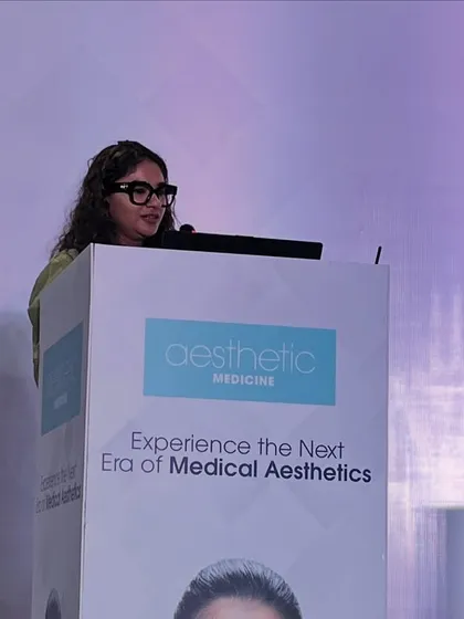 Speaking at the podium during the Aesthetic Medicine conference. My goal is always to bridge the gap between complex science and patient understanding, ensuring conversations are empowering and lead to responsible skincare choices.