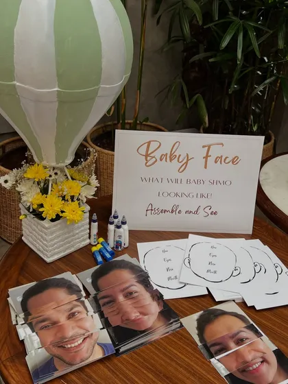A fun 'Baby Face' game station we set up, where guests could assemble pictures of the parents-to-be. It's these little details that make a celebration memorable.
