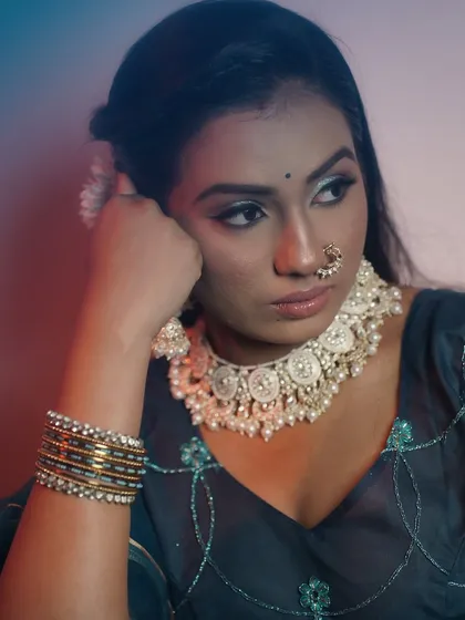 A pensive portrait that highlights the unique color combination on the eyes and the flawless skin.