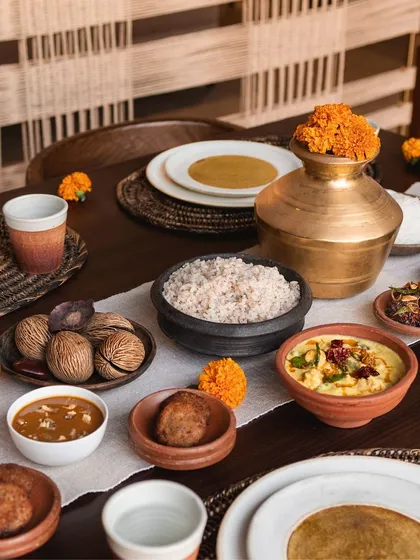 I love creating memorable private dining experiences in people's homes. I can help you set up a beautiful table like this, filled with a variety of dishes, so you can relax and enjoy the meal with your guests while my team and I handle all the details.
