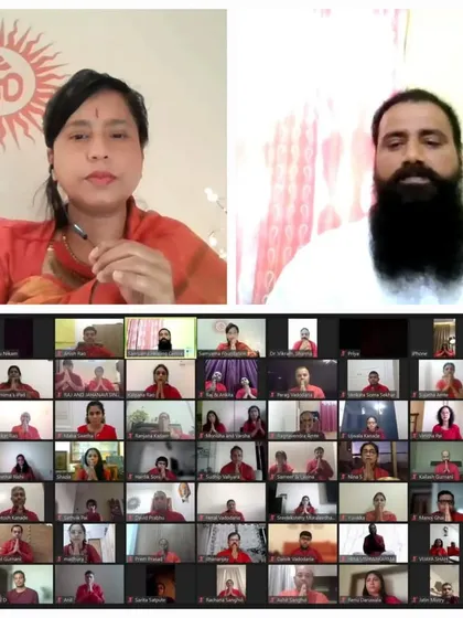 Another view of us leading the online prosperity workshop. This image, a duplicate of ID 64, shows the interactive nature of our virtual sessions, where we connect directly with participants.
