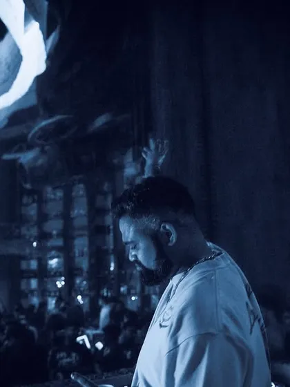 A moody, blue-toned shot of me at the decks, creating a sense of deep, atmospheric techno.