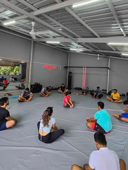 The whole class stretching it out after a tough glute focused workout.