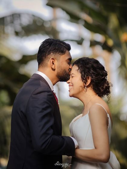 A tender forehead kiss, capturing the love and emotion of the moment.
