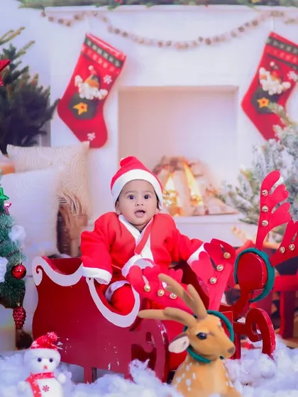 A full view of our magical Christmas setup, with a baby Santa in his sleigh, ready to deliver presents and holiday cheer.
