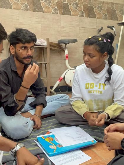 A small group of fellows engages in a deep discussion during a training workshop. We create spaces for our team to reflect, share challenges, and learn from one another's experiences.