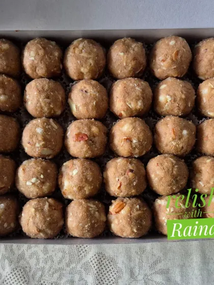 A close-up of my Gond Laddoos, showing the rich, grainy texture from the whole wheat flour and bits of almond.