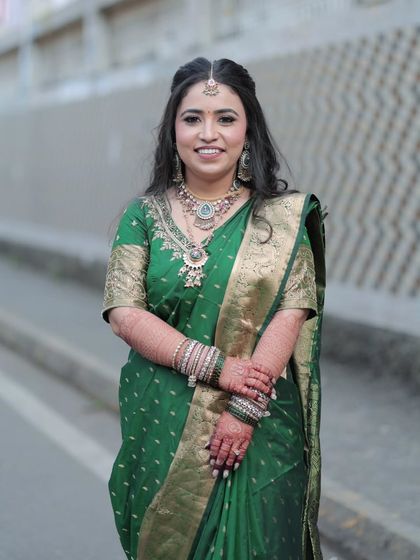 A beautiful outdoor portrait of the bride. The natural light highlights her glowing skin and the soft, blended makeup.