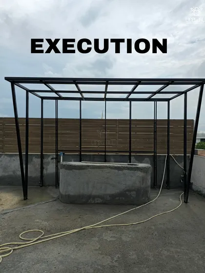 The raw structure of a bar and pergola during the "Execution" phase. This shows the solid metal and concrete base before the finishing materials are applied.