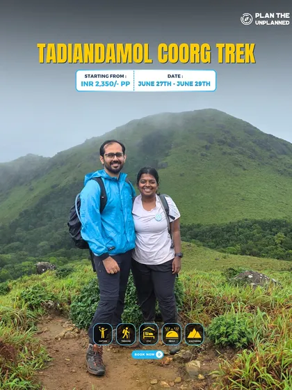 A couple enjoys the view on the Tadiandamol Coorg trek.