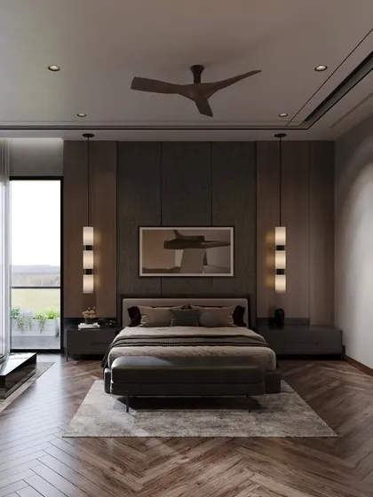 A full view of the moody villa bedroom, with a dark, textured headboard wall and elegant pendant lights flanking the bed. The large window provides a connection to the outdoors, balancing the dark palette.