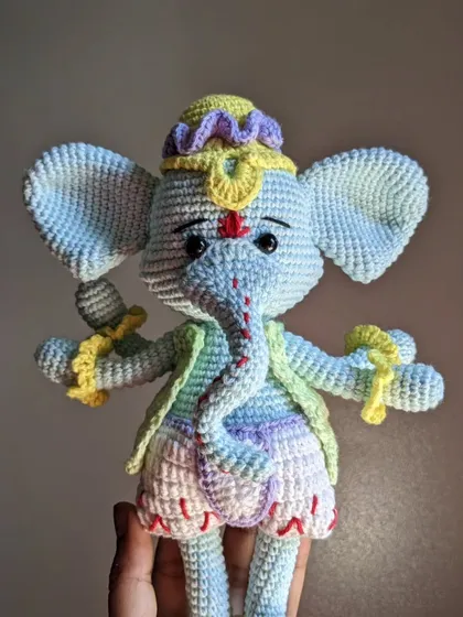 Another angle of the light-blue Ganesha, held up to show the full figure.