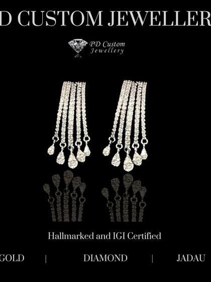 Embrace elegance with these diamond drop earrings. Multiple strands of diamonds cascade down, ending in pear-shaped drops, creating a glamorous and eye-catching effect.