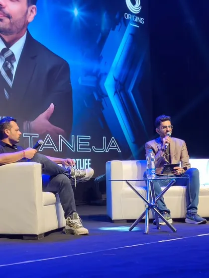 Another angle from the panel with Gaurav Taneja. The large screen behind us adds to the visual impact, and I ensure my moderation keeps the energy levels high to match.
