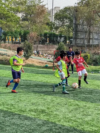 Teamwork in defense as our players work to close down an attack near the goal.