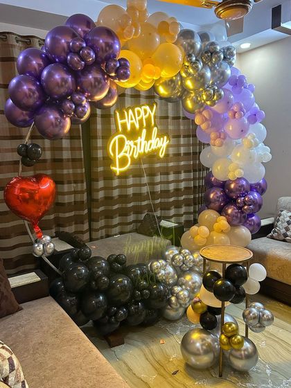 A close-up of the multi-colored balloon arrangement, highlighting the mix of colors and textures.