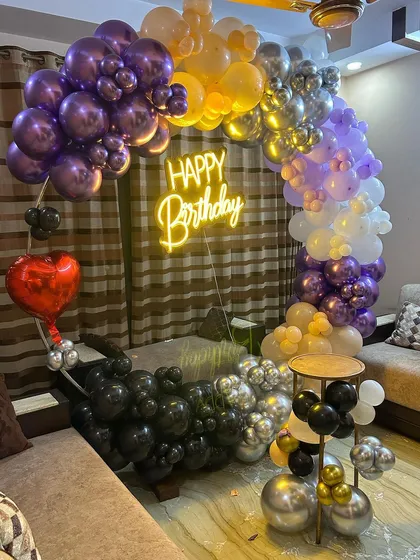 A close-up of the multi-colored balloon arrangement, highlighting the mix of colors and textures.
