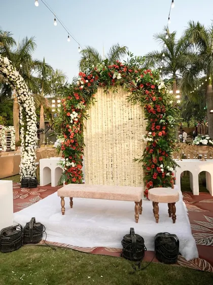 Another angle of the beautiful Nikah photo booth. The lush floral arch with red and white roses provides a perfect frame for couple and guest photos, adding a touch of romance to the event.