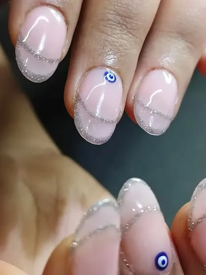 Another angle showing the sparkle of the glitter against the sheer nude base.