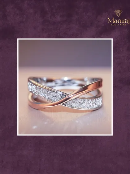 This criss-cross ring in rose and white gold is a modern classic. One band is paved with diamonds while the other is smooth polished metal, creating a beautiful contrast.