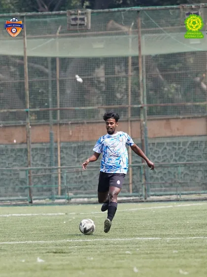 A player in full control, driving the team forward during our important MFA 1st Division match.