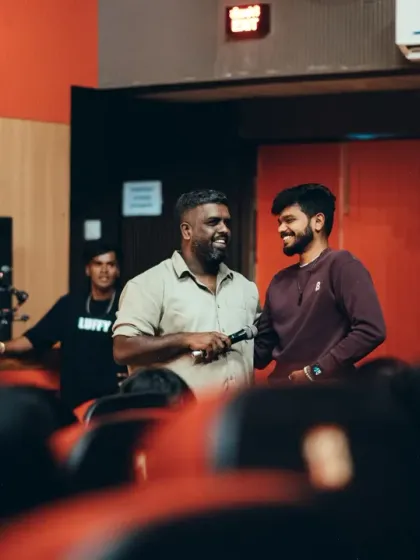 A candid moment of joy and collaboration between our team members, making sure the show runs smoothly for everyone.