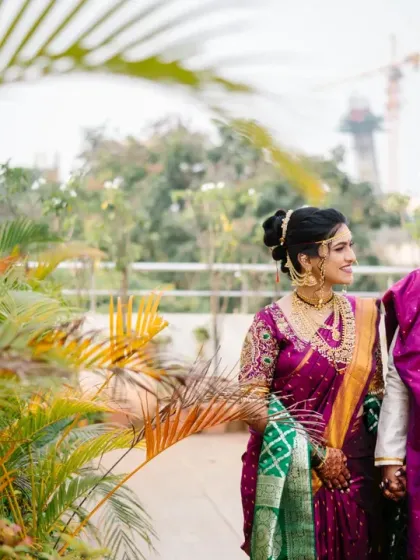 The couple takes a walk together after their ceremony, sharing a look of love. The natural greenery adds a fresh, organic feel to this wedding portrait.