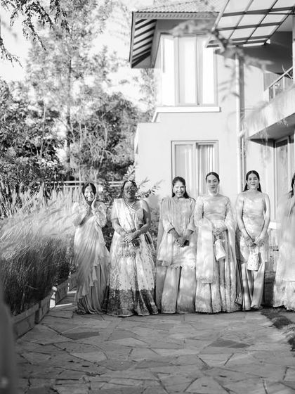 The bridesmaids' emotional reaction during the bride's first look. Capturing the joy and surprise of her closest friends is a beautiful part of the story.